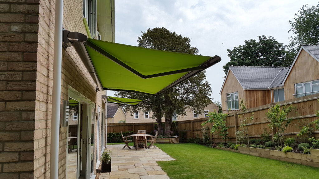 Extended retractable awning over patio in Sutton