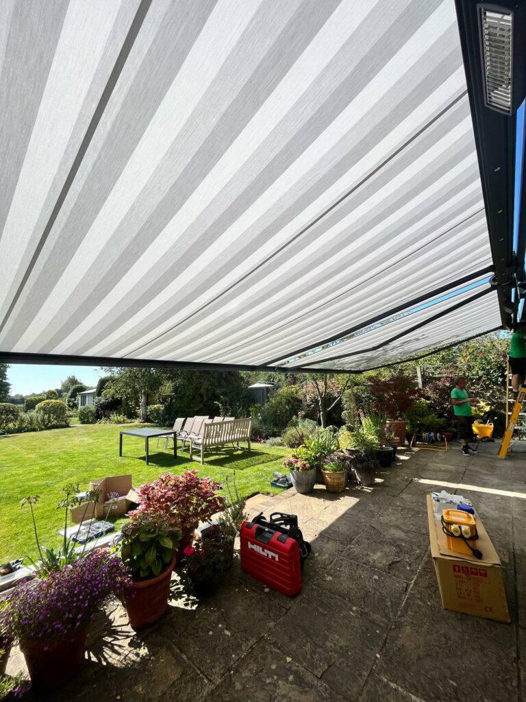 Weinor Opal Design awning with integrated lighting and heater above a patio